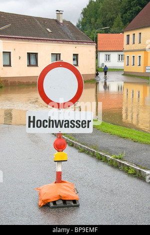 Flood sign in front of flooded road, Waldviertel, Lower Austria, Austria, Europe Stock Photo