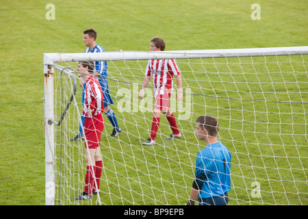 Ambleside FC playing Ulverston Town football club at Ambleside's football pitch, Lake District, UK. Stock Photo