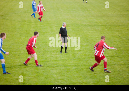 Ambleside FC playing Ulverston Town football club at Ambleside's football pitch, Lake District, UK. Stock Photo