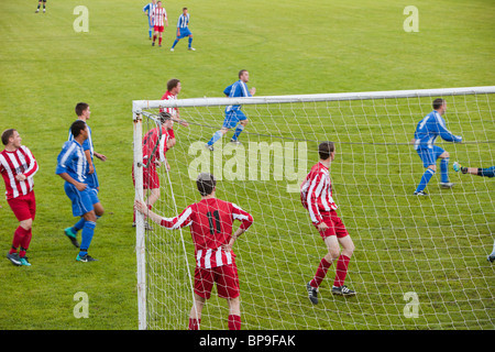 Ambleside FC playing Ulverston Town football club at Ambleside's football pitch, Lake District, UK. Stock Photo