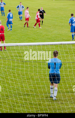 Ambleside FC playing Ulverston Town football club at Ambleside's football pitch, Lake District, UK. Stock Photo