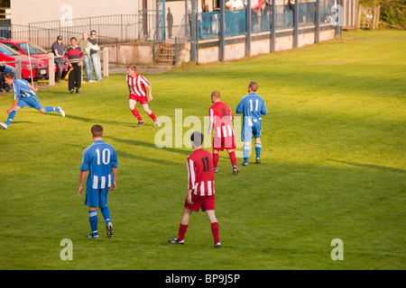 Ambleside FC playing Ulverston Town football club at Ambleside's football pitch, Lake District, UK. Stock Photo