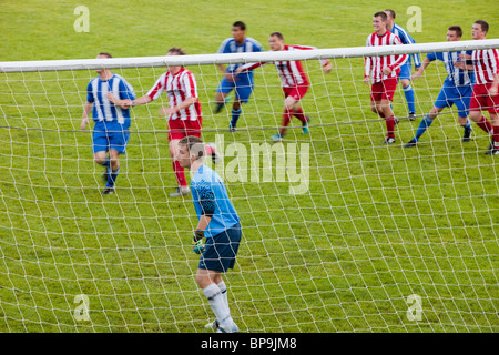 Ambleside FC playing Ulverston Town football club at Ambleside's football pitch, Lake District, UK. Stock Photo