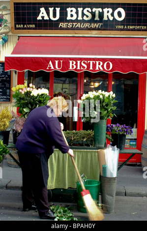 Paris, FRANCE, Street Flower Merchant, Stall, Outside Paris Bistro Restaurant, Sweeping Street Stock Photo