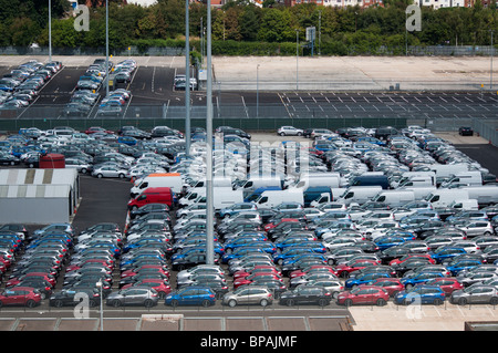 A car park full of new cars and vans awaiting export from the docks in Southampton, England. Stock Photo