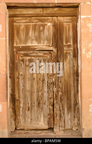 Old wooden door of a house in the 19th century mining town of Mineral de Pozos, Guanajuato state, Mexico Stock Photo