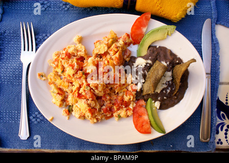 Huevos a la Mexicana and black beans breakfast in the restaurant of the hotel Posada de las Minas, Mineral de Pozos, Guanajuato state, Mexico Stock Photo