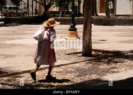 Elderly woman crossing a plaza in the 19th century mining town of Mineral de Pozos, Guanajuato state, Mexico Stock Photo