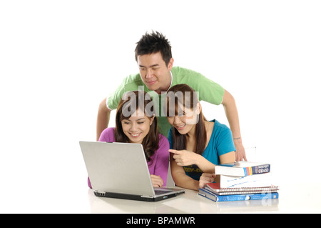 University students studying together with a laptop Stock Photo