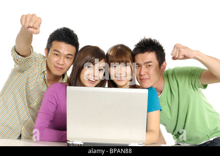 Group of university students using a laptop Stock Photo