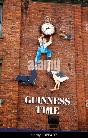 Guinness time advert on wall in Liverpool UK Stock Photo