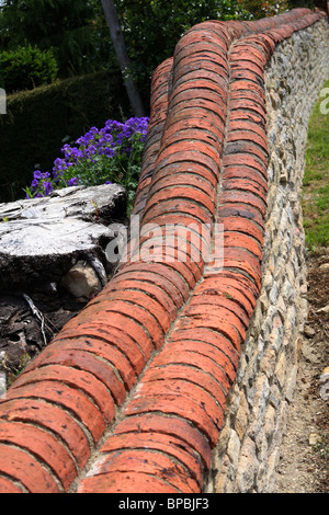 There are so many ways a garden wall can be built and so many different bricks, blocks and stone that can be used. Stock Photo