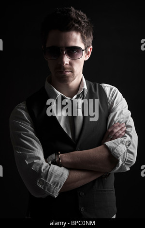 Low Key Shot of a Handsome Male in Sunglasses Stock Photo