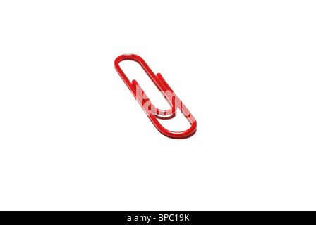 Metal red paper clip for business in office isolated on white background. Paperclip paper holder accessory. Stock Photo