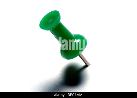 Macro of green drawing pin isolated on white background. Stock Photo