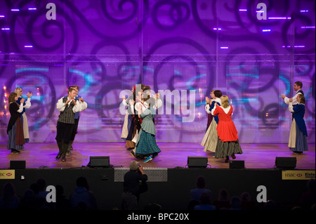 Folk dancing group performing on stage in competition at the National Eisteddfod of Wales annual cultural festival Stock Photo