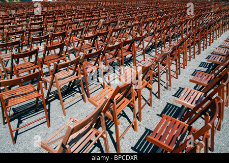 Rows of wooden chairs Stock Photo
