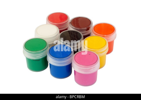 Closed jars with colored gouache. Isolated on white background with clipping path. Stock Photo