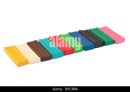 Row of colored plasticine bricks. Isolated on white background with clipping path. Stock Photo