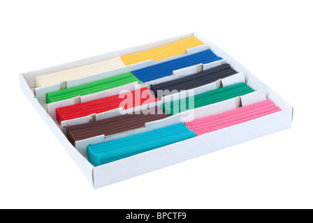 Box with pieces of colored plasticine. Isolated on white background with clipping path. Stock Photo