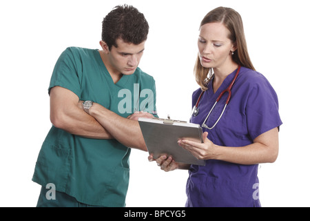 Nurses discussing patient chart Stock Photo