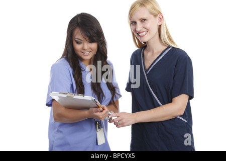 Medical staff going over patient chart Stock Photo