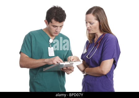 Nurses discussing patient chart