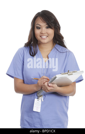 Nurse adding patient history to chart Stock Photo