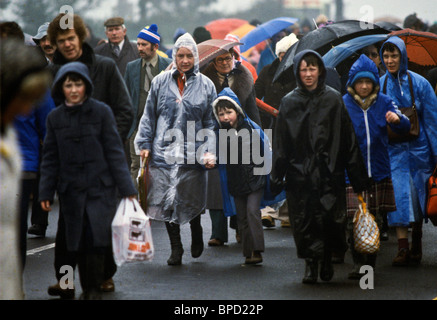 Crowds struggle through heavy rain after attending mass celebrated by Pope John Paul II in Knock, Ireland Stock Photo