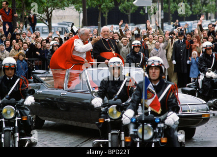 Open-topped car police outriders minimal security for Pope John Paul II waving to the crowd in Paris on official visit to France Stock Photo