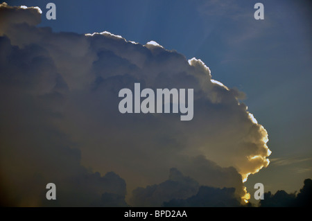 Cloud with sun behind it Stock Photo