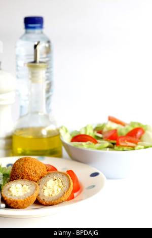 Fresh Tasty Savoury Scotch Eggs With A Mixed Salad Garnish Against A White Background With A Clipping path And No People Stock Photo