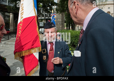 Paris, France, Senior French men Celebrate the Anniversary of Paris Liberation, Old War Veterans, Holding Flag on Street Ceremony Events, elderly people, French resistance, commemorating Paris, holocaust jews wwii Stock Photo