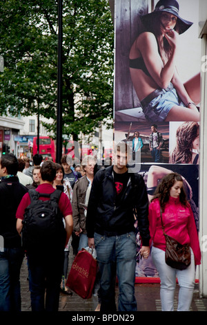 Shoppers in the heart of the mid range shopping district on Oxford Street. This is the busiest area for retail in London. Stock Photo