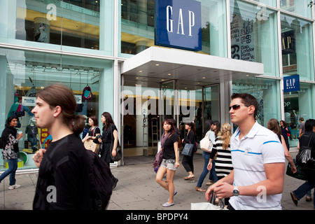 Shoppers in the heart of the mid range shopping district on Oxford Street. This is the busiest area for retail in London. Stock Photo