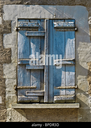 Old repaired house window shutter - sud-Touraine, France. Stock Photo