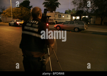 Las Vegas Police CSI officer photographs a car at the scene of a crime. Stock Photo