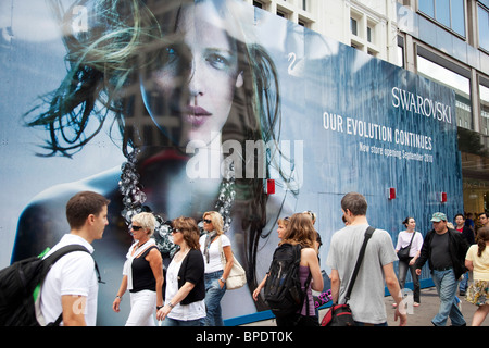 Shoppers in the heart of the mid range shopping district on Oxford Street. This is the busiest area for retail in London. Stock Photo