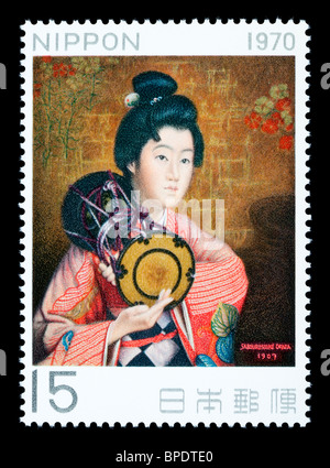 JAPAN - CIRCA 1970: A postage stamp printed in Japan showing a painting of a Japanese woman, circa 1970 Stock Photo