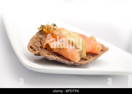Pumpernickel bread with smoked salmon, close-up Stock Photo