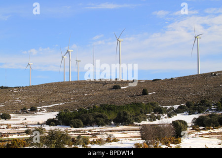 aerogenerator electric windmills on snow mountain Stock Photo
