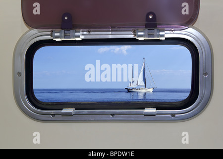 Boat porthole sailboat view blue ocean sea sky horizon Stock Photo