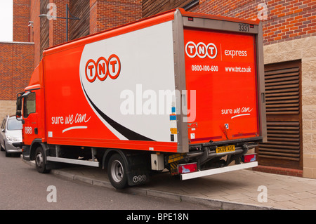 A TNT express courier van in Norwich , Norfolk , England , Great Britain , Uk Stock Photo