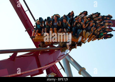 People enjoying a ride on the Demon roller coaster in Tivoli Gardens, Copenhagen, Denmark. Stock Photo