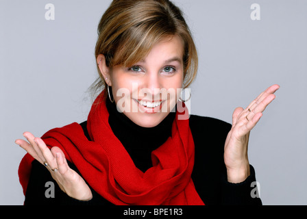 Beautiful Blond Young Woman Wearing A Red Scarf With A Surprised Expression Stock Photo
