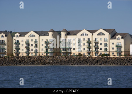seafront apartment blocks on the belfast lough shoreline at carrickfergus county antrim northern ireland uk Stock Photo