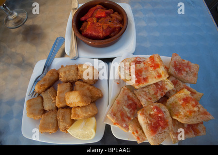 Barcelona tapas: pan con tomate, chocos and bacalla con samfaina Stock Photo