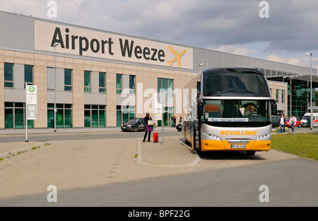 Terminal building at Weeze (Niederrhein) Airport with Düsseldorf & Cologne shuttle bus, North Rhine-Westphalia, Germany. Stock Photo