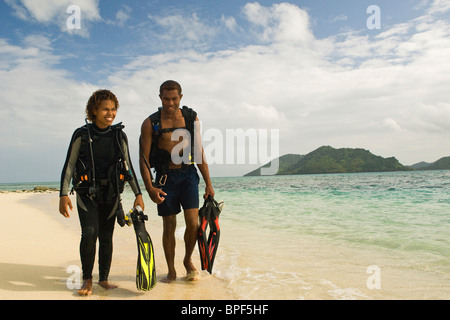 Couple enjoying a day of snorkeling and scuba diving on Picnic Island near Beqa Lagoon Resort, Beqa Island, Stock Photo