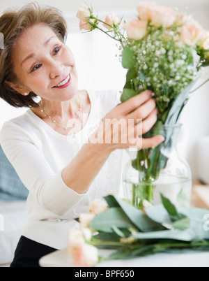 Japanese woman arranging flowers Stock Photo